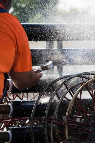 Technician working on sprinkler equipment